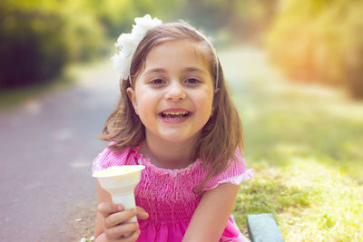 Portrait of a smiling girl with ice cream