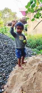 Portrait of boy standing outdoors