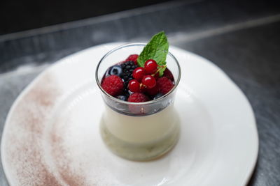 High angle view of strawberries in bowl on table