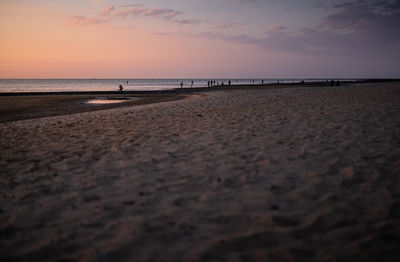 Scenic view of beach against sky during sunset