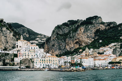 Panoramic view of buildings on dramatic coastline