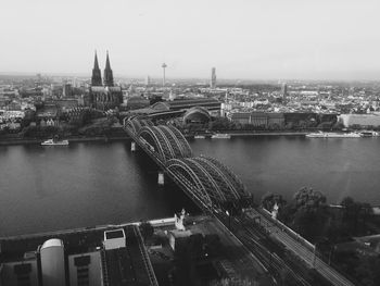 High angle view of bridge over river in city against sky