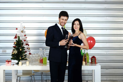 Young couple standing on glass outdoors