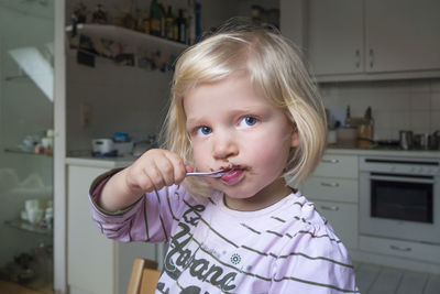 Portrait of cute girl at home