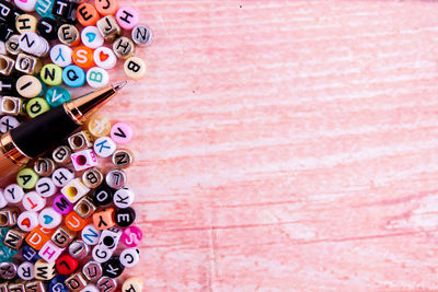 Directly above shot of pen and letters on table