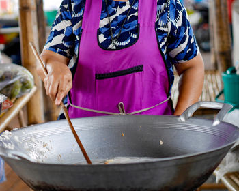 Close-up of woman working in tray