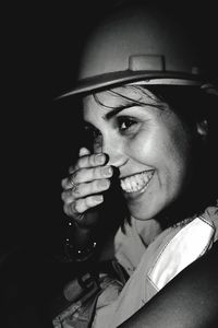 Close-up portrait of smiling young woman