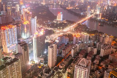 High angle view of illuminated modern buildings in city