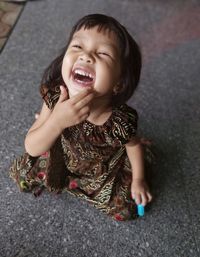 High angle view of cute girl smiling