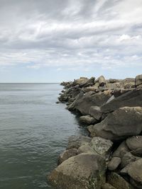 Rocks on shore against sky