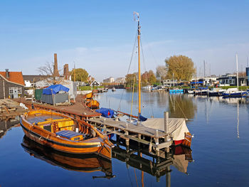 Harbor from huizen with old fashioned sailing boats in the netherlands