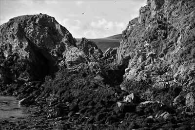 Rock formation on land against sky