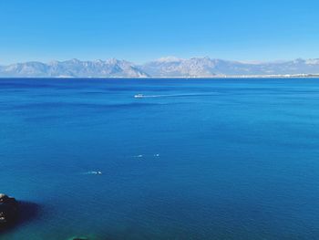 Scenic view of sea against blue sky