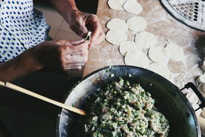 High angle view of man preparing food