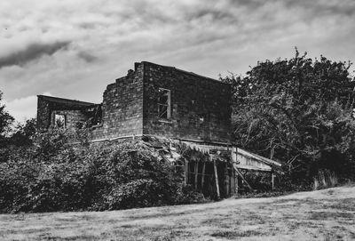 Abandoned building against sky