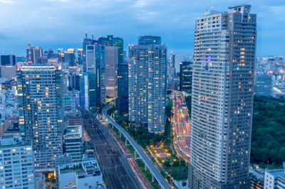 High angle view of buildings in city against sky