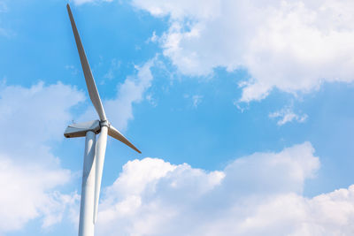 Low angle view of wind turbine against sky