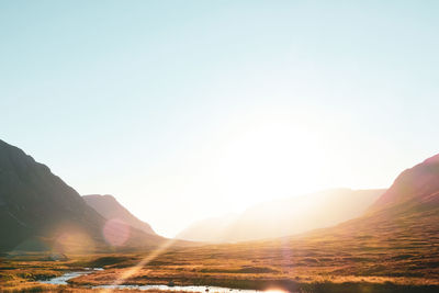 Scenic view of mountains against sky during sunset