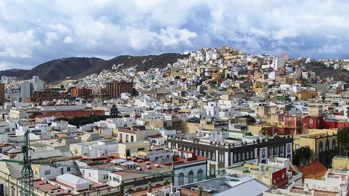 Aerial view of town against sky