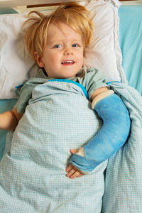 Portrait of cute baby girl sleeping on bed