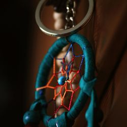 Close-up of turquoise dreamcatcher