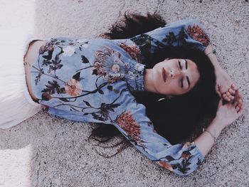 High angle view portrait of cute girl lying down