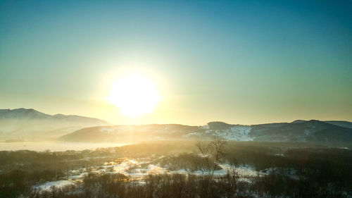 Scenic view of landscape against sky during sunset
