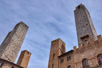 Low angle view of historical building against cloudy sky