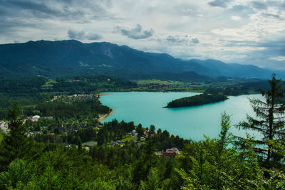 Scenic view of lake and mountains against sky