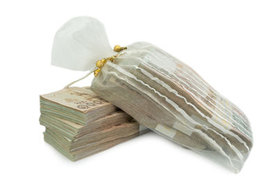Close-up of bread on white background