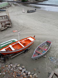 High angle view of abandoned boat moored on beach