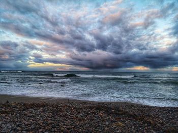 Scenic view of sea against dramatic sky