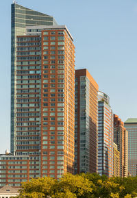 Low angle view of modern buildings against clear sky