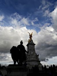 Low angle view of statue against cloudy sky