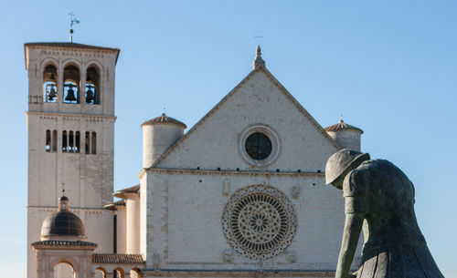 Low angle view of bell tower against sky