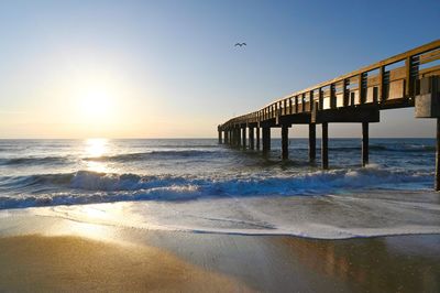 View of beach against sky during sunset
