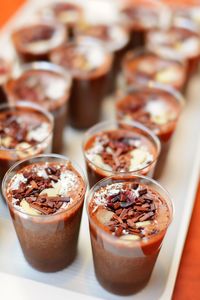 Close-up of chocolate mousse glasses in tray