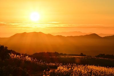 Scenic view of mountains against sky during sunrise