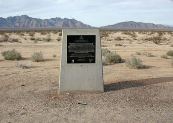 Built structure on desert against sky