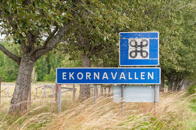 Close-up of information sign on road