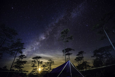 Low angle view of tent against star field at night
