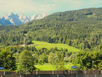 Scenic view of landscape and mountains against sky