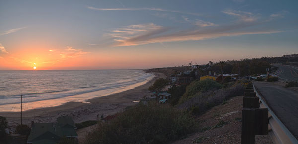 Scenic view of beach at sunset