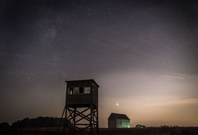 Low angle view of tower against sky at night showing stars and milky way 