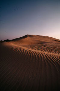 Scenic view of desert against clear sky