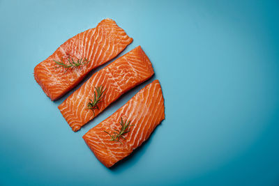 Directly above shot of fruit against blue background