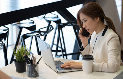 Man using laptop on table