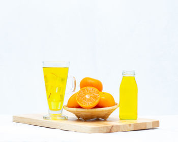 Fruits on table against white background