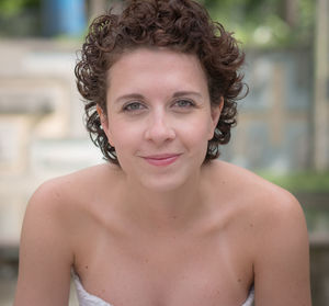 Portrait of smiling young woman outdoors