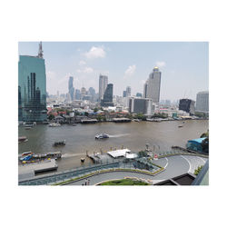 Panoramic view of city buildings against sky